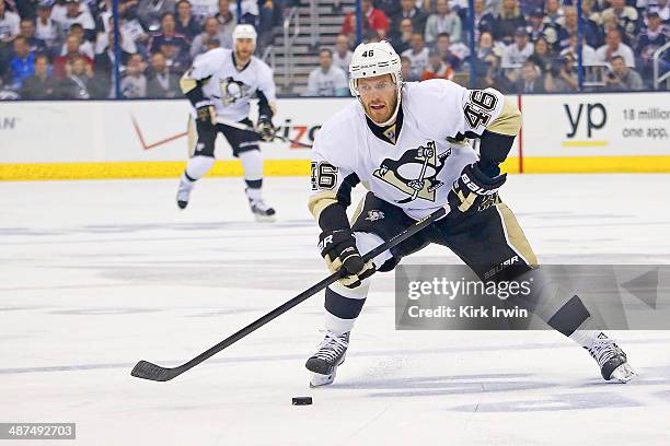 Joe Vitale of the Pittsburgh Penguins controls the puck during Game Six of the First Round of the 2014 NHL Stanley Cup Playoffs against the Columbus...