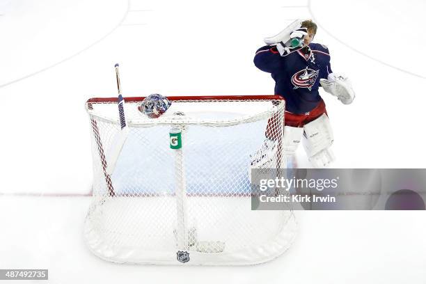 Sergei Bobrovsky of the Columbus Blue Jackets takes a drink of water prior to the start of Game Six of the First Round of the 2014 NHL Stanley Cup...