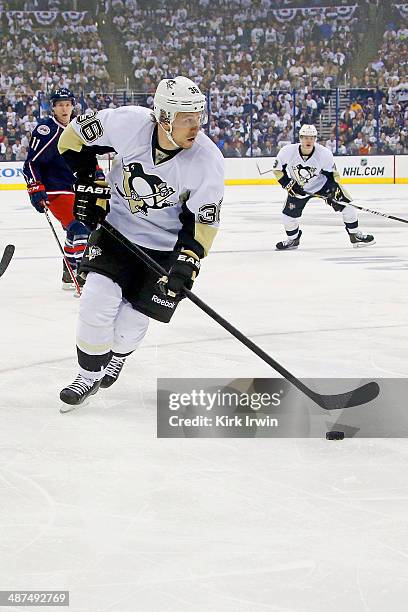 Jussi Jokinen of the Pittsburgh Penguins controls the puck during Game Six of the First Round of the 2014 NHL Stanley Cup Playoffs against the...