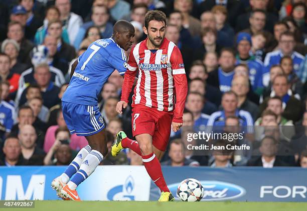 Adrian Lopez Alvarez of Atletico Madrid in action is watched by Ramires of Chelsea during the UEFA Champions League semi final second leg match...