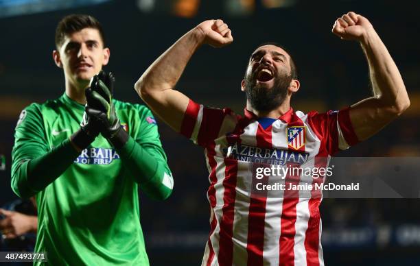 Arda Turan and Thibaut Courtois of Club Atletico de Madrid celebrate victory after the UEFA Champions League semi-final second leg match between...