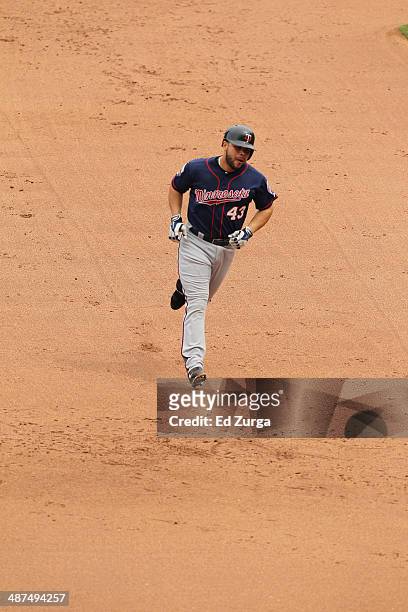 Josmil Pinto of the Minnesota Twins runs the bases after hitting a home run against the Kansas City Royals at Kauffman Stadium on April 20, 2014 in...
