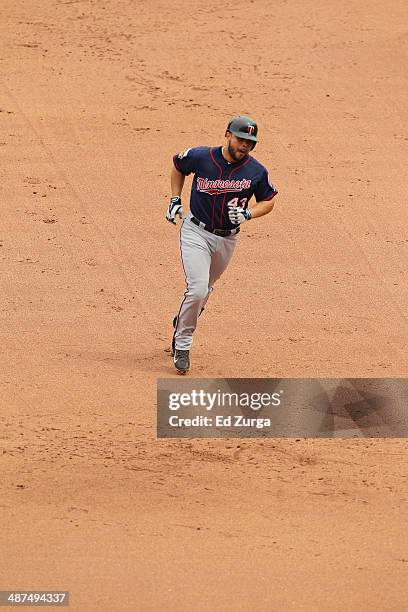 Josmil Pinto of the Minnesota Twins runs the bases after hitting a home run against the Kansas City Royals at Kauffman Stadium on April 20, 2014 in...