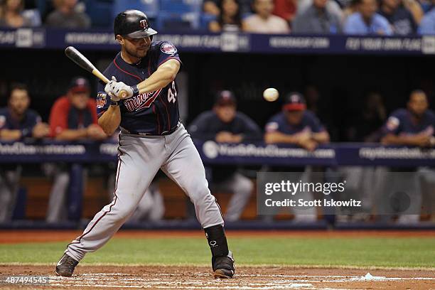 Josmil Pinto of the Minnesota Twins swings at the ball against the Tampa Bay Rays at Tropicana Field on April 23, 2014 in St Petersburg, Florida.