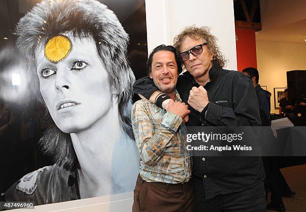 Author/editor Reuel Golden and photographer Mick Rock attend the TASCHEN Gallery opening reception for "Mick Rock: Shooting For Stardust - The Rise...