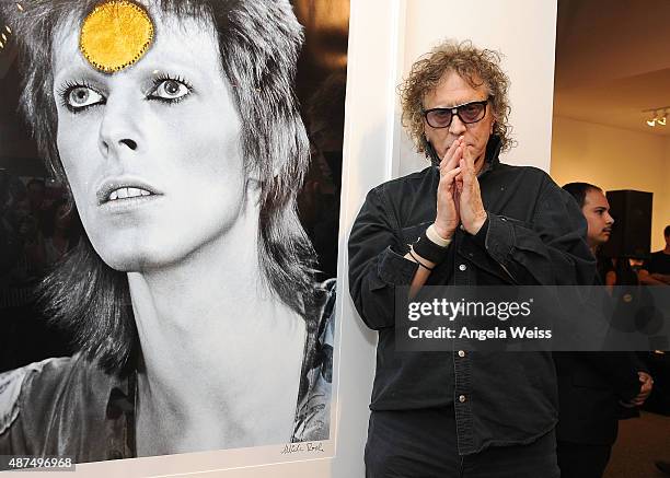 Photographer Mick Rock attends the TASCHEN Gallery opening reception for "Mick Rock: Shooting For Stardust - The Rise Of David Bowie & Co." at...