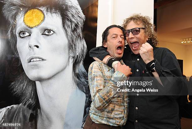 Author/editor Reuel Golden and photographer Mick Rock attend the TASCHEN Gallery opening reception for "Mick Rock: Shooting For Stardust - The Rise...