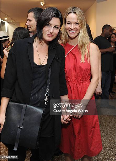 Musician Camila Grey and actress/musician Leisha Hailey attend the TASCHEN Gallery opening reception for "Mick Rock: Shooting For Stardust - The Rise...