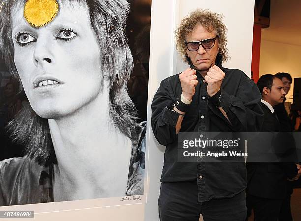 Photographer Mick Rock attends the TASCHEN Gallery opening reception for "Mick Rock: Shooting For Stardust - The Rise Of David Bowie & Co." at...