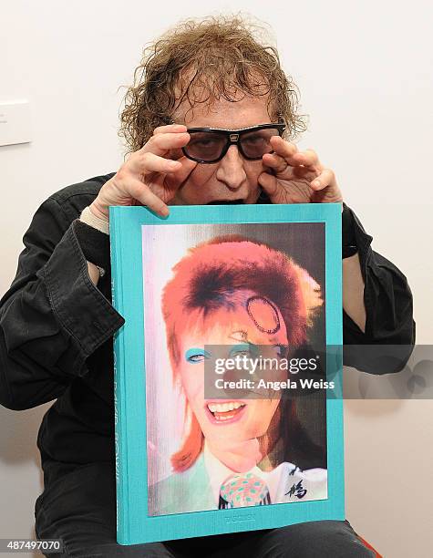 Photographer Mick Rock attends the TASCHEN Gallery opening reception for "Mick Rock: Shooting For Stardust - The Rise Of David Bowie & Co." at...