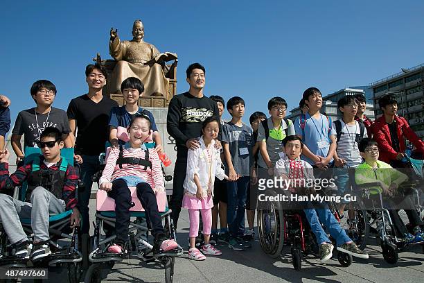 Dong Hyun Kim poses in front of a statue of the Great King Sejong on September 10, 2015 in Seoul, South Korea.