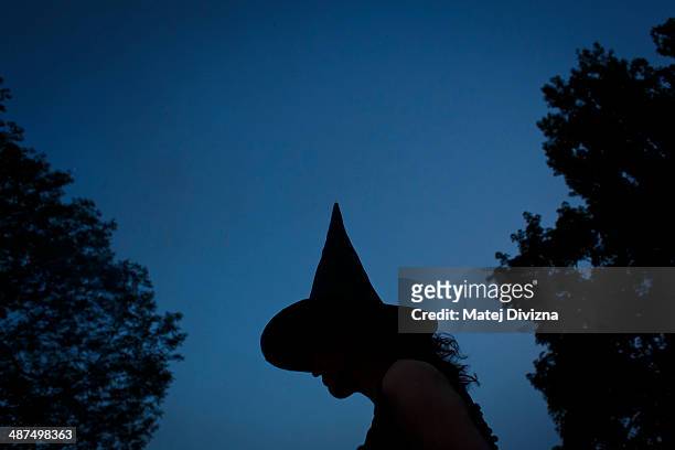 Woman dressed as witch attends festivities in Kampa park on Walpurgis night on April 30, 2013 in Prague, Czech Republic. Walpurgis night, named after...