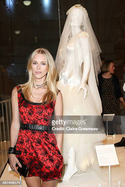 Lady Mary Charteris poses next to her wedding dress designed by Pam Hogg as she attends the Wedding Dresses 1775-2014 Exhibition private view at the...