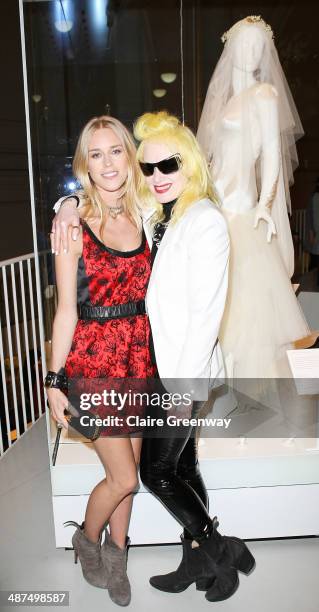 Lady Mary Charteris and designer of her wedding dress, Pam Hogg, pose next to the dress as they attend the Wedding Dresses 1775-2014 Exhibition...