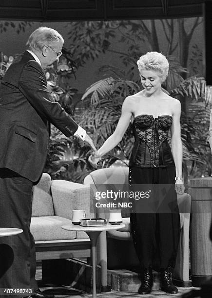 Pictured: Announcer Ed McMahon greets singer Madonna on June 9, 1987 --