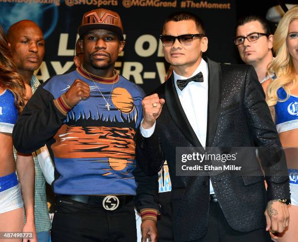 Welterweight champion Floyd Mayweather Jr. And WBA champion Marcos Maidana pose during a news conference at the MGM Grand Hotel/Casino on April 30,...