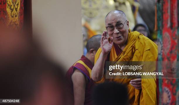 Tibetan spiritual leader His Holiness the Dalai Lama greets followers before starting lectures on Buddhist philosophy at the Tsuglakhang Temple in...