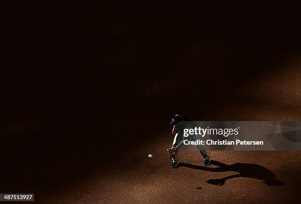 Justin Morneau of the Colorado Rockies fields a ground ball during warm ups to the MLB game against the Arizona Diamondbacks at Chase Field on April...