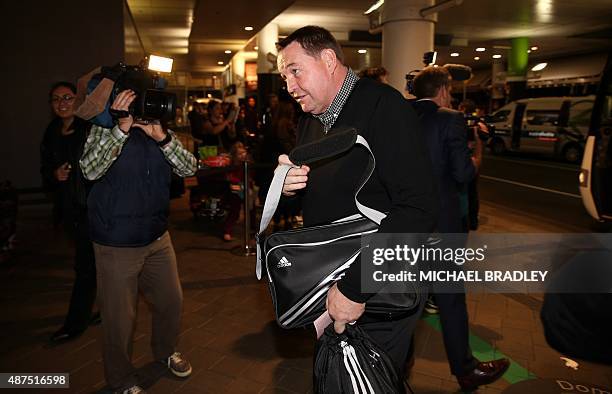 New Zealand All Blacks coach Steve Hansen arrives at the Auckland International Airport in Auckland on September 10, 2015 before departing to the...