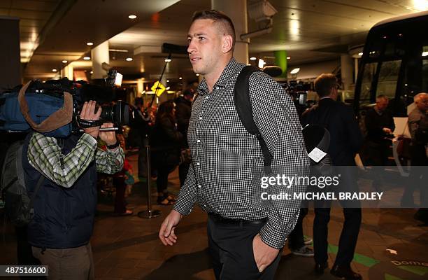 New Zealand All Blacks Luke Romano arrives at the Auckland International Airport in Auckland on September 10, 2015 before departing to the Rugby...