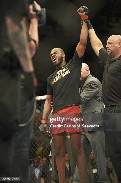 Jon Jones victorious in ring after winning Light Heavyweight Championship bout vs Glover Teixeira at Baltimore Arena. Baltimore, MD 4/26/2014 CREDIT:...