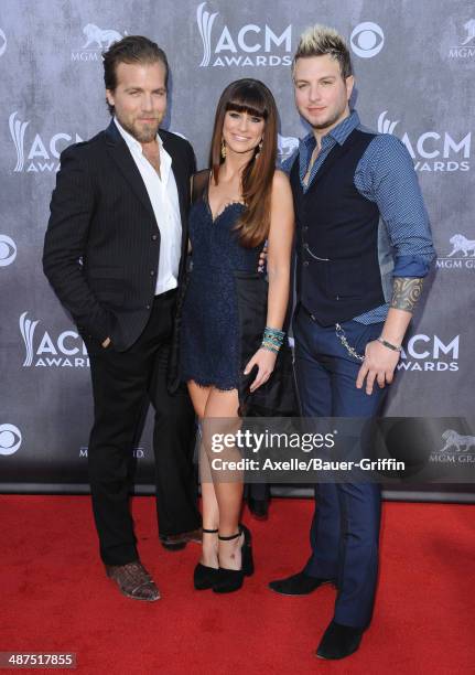 Musicians Tom Gossin, Rachel Reinert and Mike Gossin of Gloriana arrive at the 49th Annual Academy of Country Music Awards at the MGM Grand Hotel and...