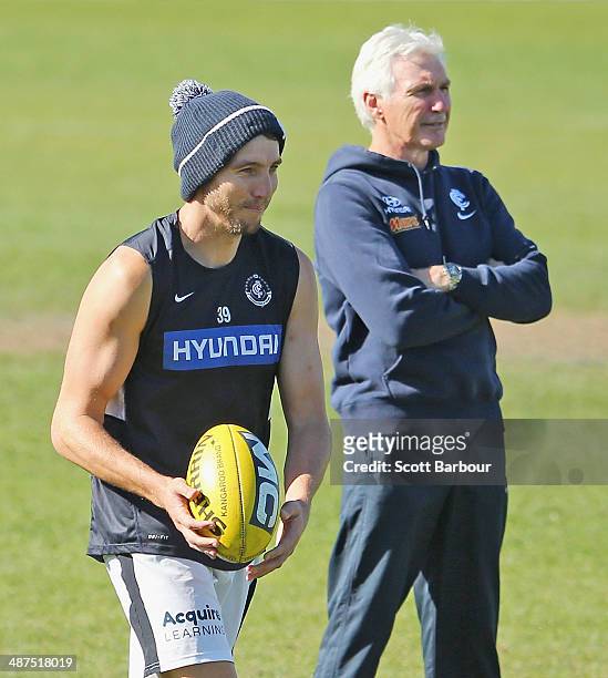 Dale Thomas and Mick Malthouse, coach of the Blues look on during a Carlton Blues AFL training session at Visy Park on May 1, 2014 in Melbourne,...