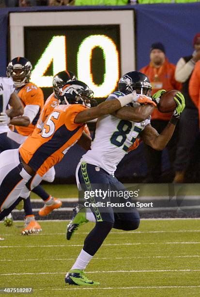 Ricardo Lockette of the Seattle Seahawks catches a pass over Dominique Rodgers-Cromartie of the Denver Broncos during Super Bowl XLVIII on February...