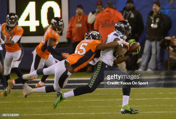 Ricardo Lockette of the Seattle Seahawks catches a pass over Dominique Rodgers-Cromartie of the Denver Broncos during Super Bowl XLVIII on February...