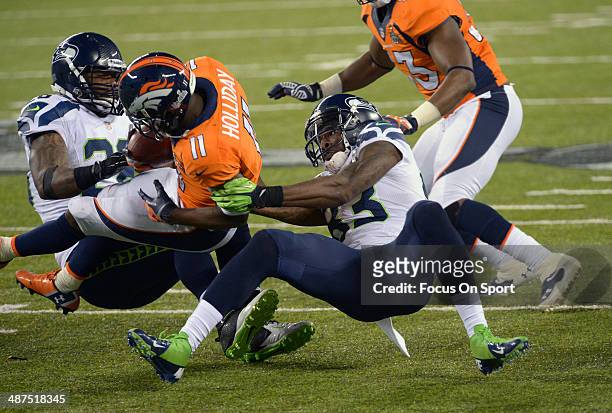 Trindon Holliday returning a kickoff is tackled by Ricardo Lockette of the Seattle Seahawks during Super Bowl XLVIII on February 2, 2014 at MetLife...