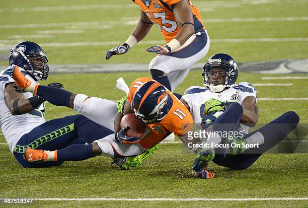 Trindon Holliday returning a kickoff is tackled by Ricardo Lockette of the Seattle Seahawks during Super Bowl XLVIII on February 2, 2014 at MetLife...