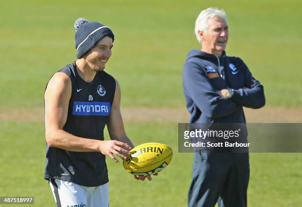 Dale Thomas and Mick Malthouse, coach of the Blues look on during a Carlton Blues AFL training session at Visy Park on May 1, 2014 in Melbourne,...