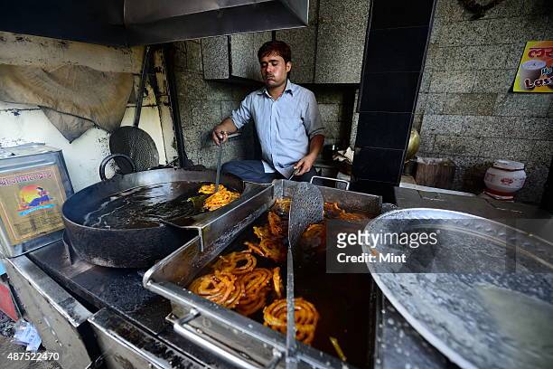 The old famous Jalebi wala at the corner of Dariba in Chandni Chowk, on August 20, 2014 in New Delhi, India. Chandni Chowk , often called the food...