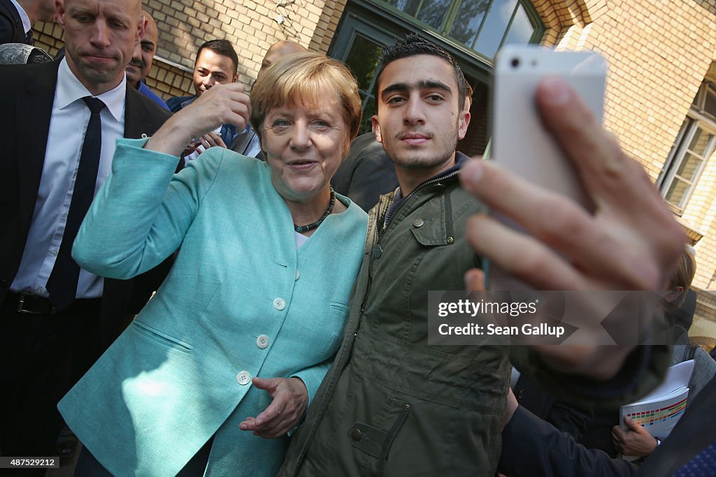 Merkel Visits Migrants' Shelter And School