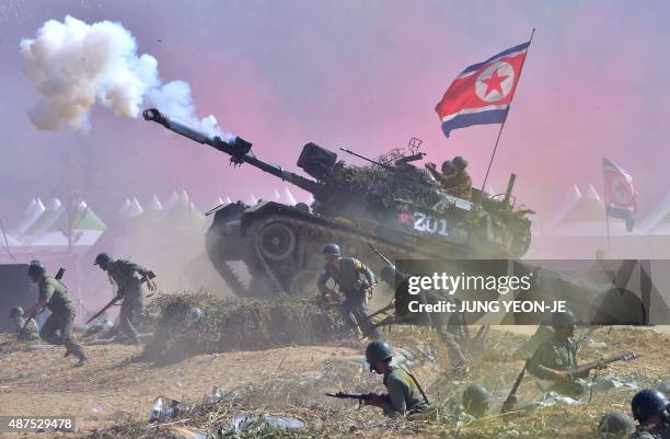 South Korean soldiers play the roles of both South Korean forces and invading North Korean soldiers during a re-enactment of the 1950 battle of...