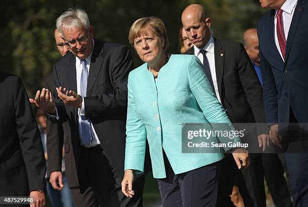 German Chancellor Angela Merkel arrives to visit the AWO Refugium Askanierring shelter for migrants on September 10, 2015 in Berlin, Germany. Merkel...