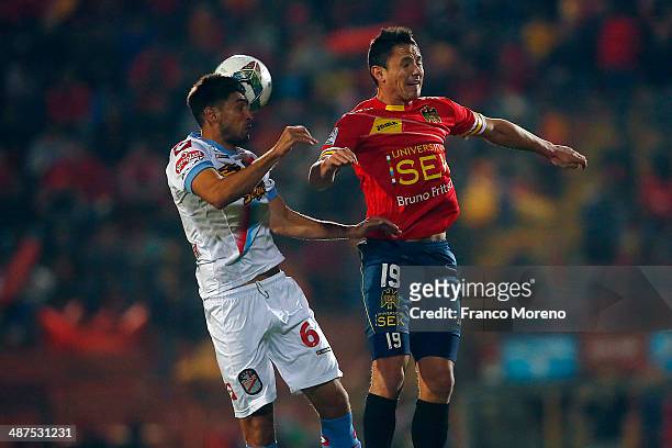 Gustavo Canales of Union Espanola fights for the ball with Diego Braghieri of Arsenal during a match between Union Espanola and Arsenal as part...