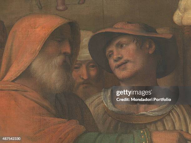 Italy, Lombardy, Como, Como Cathedral. Detail. A young man looking at an old man, who is pointing at the holy worshipping of the Wise Men.