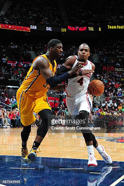 Paul Millsap of the Atlanta Hawks drives against the Indiana Pacers during Game Four of the Eastern Conference Quarterfinals on April 26, 2014 at...