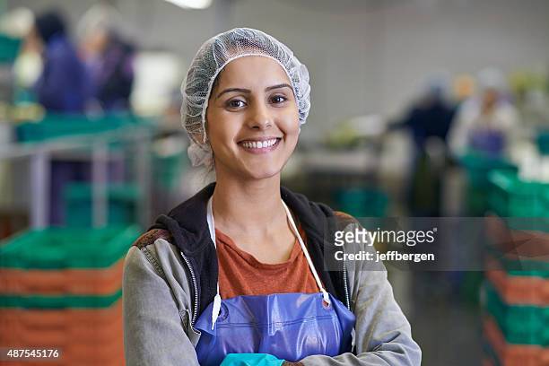 she takes pride in her work - hair net stock pictures, royalty-free photos & images