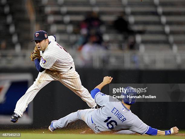 Brian Dozier of the Minnesota Twins gets the force out of Andre Ethier of the Los Angeles Dodgers at second base during the ninth inning of the game...