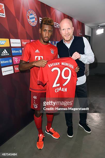 Kingsley Coman; and Matthias Sammer during the 'FC Bayern Muenchen Unveils New Signing Kingsley Coman' at press center of FC Bayern on September 10,...