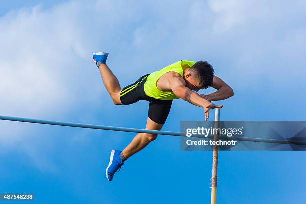 teenager at succsesfull jump - pole vault stock pictures, royalty-free photos & images