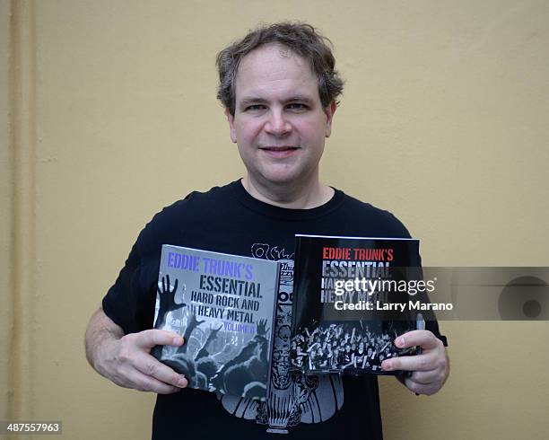 Eddie Trunk poses with his books at Hard Rock Live! in the Seminole Hard Rock Hotel & Casino on April 30, 2014 in Hollywood, Florida.