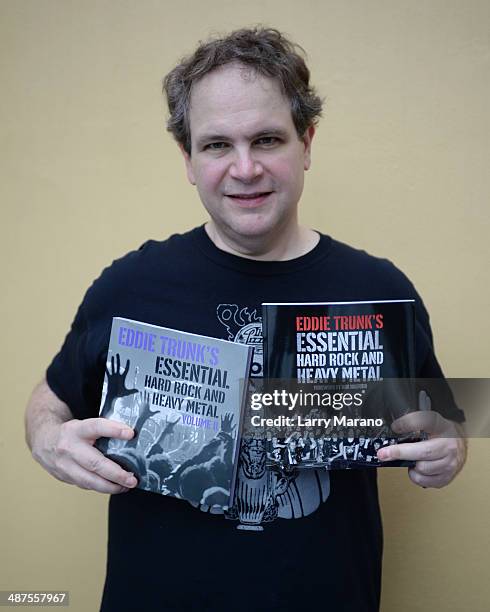 Eddie Trunk poses with his books at Hard Rock Live! in the Seminole Hard Rock Hotel & Casino on April 30, 2014 in Hollywood, Florida.