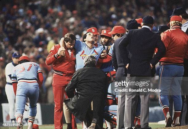 World Series: St. Louis Cardinals Joaquin Andujar being helped off field by teammates after being struck in leg by line drive during Game 3 vs...