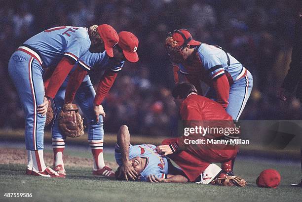 World Series: St. Louis Cardinals Joaquin Andujar lying on field surrounded by trainer and teammates after being struck in leg by line drive during...