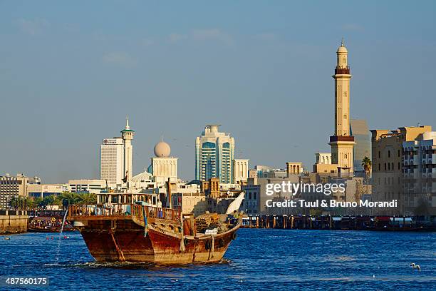 united arab emirates, dubai, deira neighbourhood - the united arab emirates flag stock pictures, royalty-free photos & images