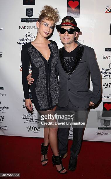 Model Courtney Anne and actor Corey Feldman attend "30 Years of Music, Art & Fashion" benefiting Miller Children's Hospital at The Attic on April 30,...