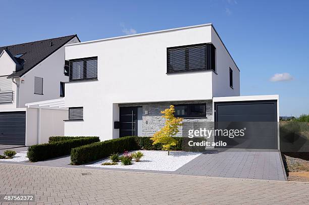 modern white house with garage - facade stock pictures, royalty-free photos & images